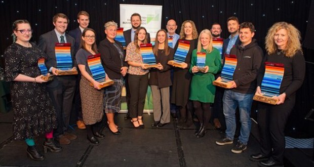 VIBES 2023 winners and commended businesses in front of VIBES banner with Nicole Paterson, CEO of SEPA, and Sean Batty from STV